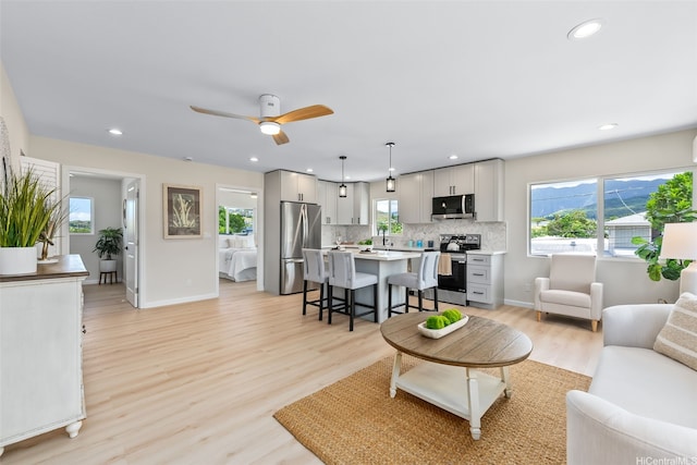 1076 Kahili St, Kailua, HI 96734 - living area with recessed lighting, ceiling fan, and light wood-style flooring