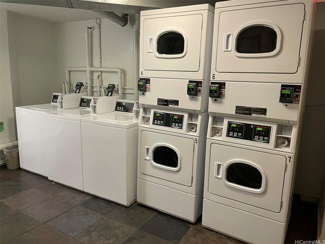 1700 Ala Moana Blvd Unit 1702, Honolulu, HI 96815 - community laundry with stacked washer / drying machine, independent washer and dryer, and dark stone finish flooring