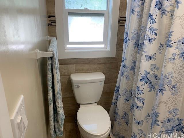 3395 Hardesty St, Honolulu, HI 96816 - full bath featuring tile walls and a wainscoted wall