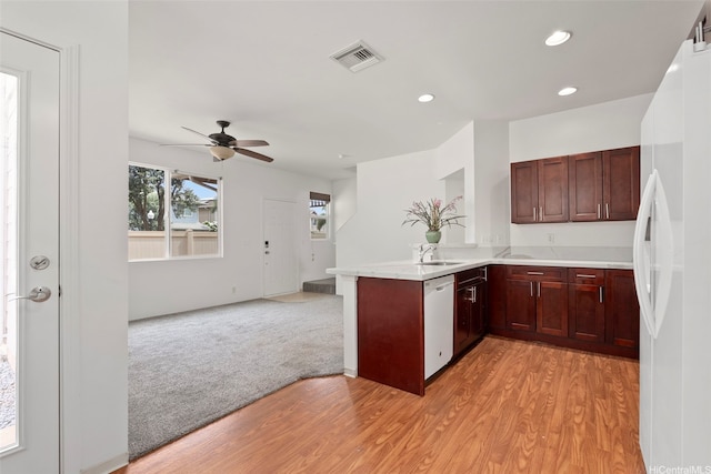 91-1001 Keaunui Dr Unit 97, Ewa Beach, HI 96706 - kitchen with white appliances, a peninsula, light wood finished floors, open floor plan, and ceiling fan