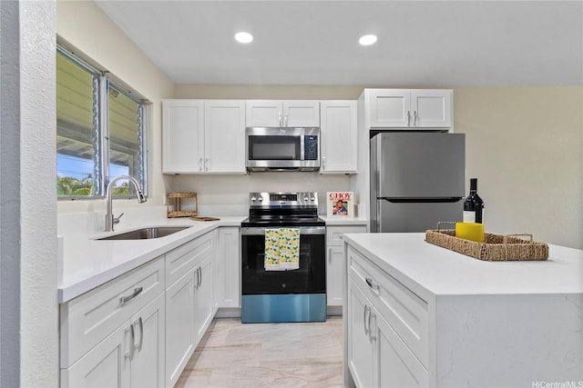 98-467 Hookanike St Unit 758, Pearl City, HI 96782 - kitchen featuring appliances with stainless steel finishes, white cabinets, recessed lighting, light countertops, and light marble finish floors