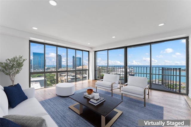 700 Richards St Unit 1709, Honolulu, HI 96813 - living room with wood finished floors, healthy amount of natural light, a water view, and recessed lighting