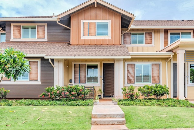 94-1188 Kalahikiola Dr Unit 1005, Waipahu, HI 96797 - multi unit property with board and batten siding, a front lawn, and roof with shingles