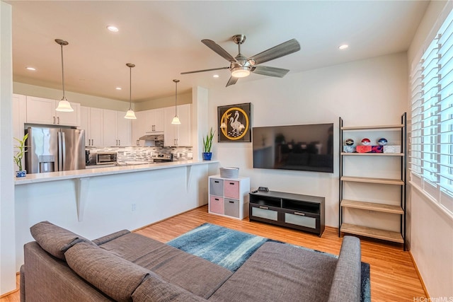 94-1188 Kalahikiola Dr Unit 1005, Waipahu, HI 96797 - living room with plenty of natural light, ceiling fan, light wood finished floors, and recessed lighting