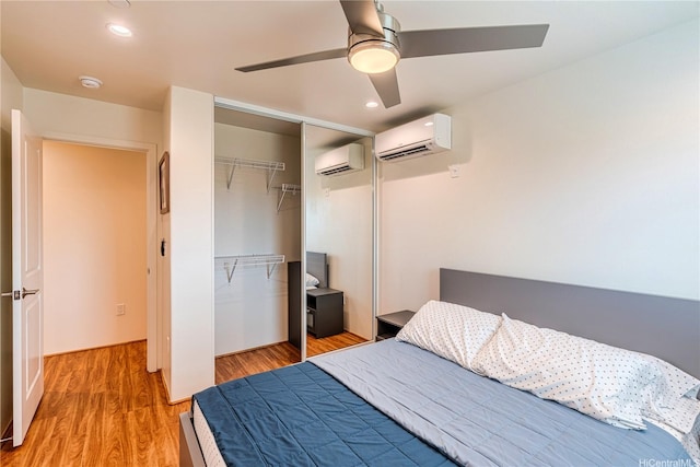 94-1188 Kalahikiola Dr Unit 1005, Waipahu, HI 96797 - bedroom featuring a wall mounted AC, a closet, light wood-style flooring, ceiling fan, and recessed lighting