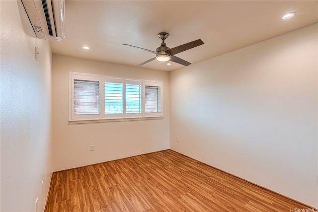 94-1188 Kalahikiola Dr Unit 1005, Waipahu, HI 96797 - spare room featuring a wall unit AC, ceiling fan, light wood-style floors, and recessed lighting