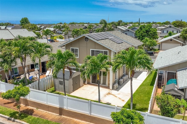 91-2037 Pahuhu Pl, Ewa Beach, HI 96706 - view of front of home featuring a residential view, a fenced backyard, roof with shingles, and a patio