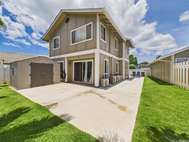 91-2037 Pahuhu Pl, Ewa Beach, HI 96706 - back of property featuring a storage unit, a patio area, board and batten siding, and concrete driveway