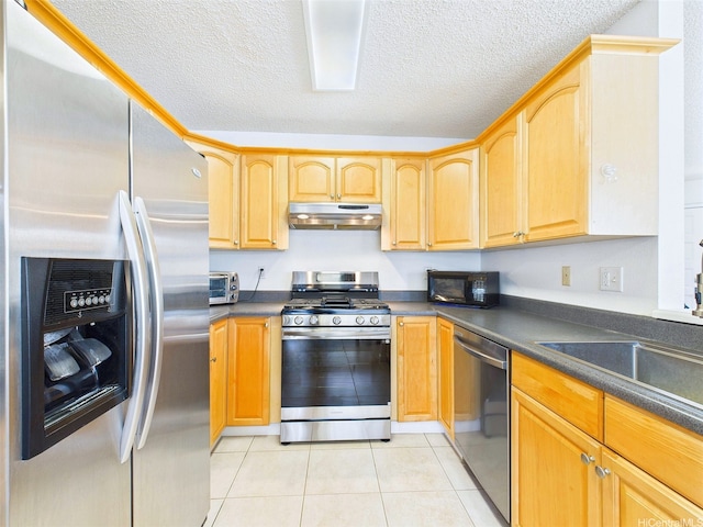 91-2037 Pahuhu Pl, Ewa Beach, HI 96706 - kitchen featuring appliances with stainless steel finishes, under cabinet range hood, dark countertops, light tile patterned floors, and a textured ceiling