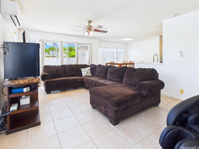 91-2037 Pahuhu Pl, Ewa Beach, HI 96706 - living area featuring an AC wall unit, a ceiling fan, a textured ceiling, and light tile patterned floors