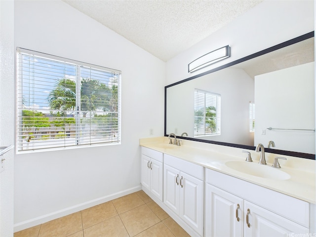 91-2037 Pahuhu Pl, Ewa Beach, HI 96706 - full bath featuring vaulted ceiling, double vanity, tile patterned floors, and a textured ceiling