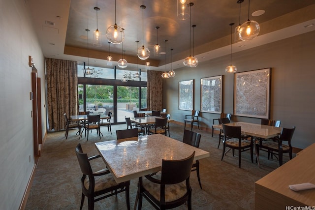 1555 Kapiolani Blvd Unit 1205, Honolulu, HI 96814 - dining space with a raised ceiling and dark carpet