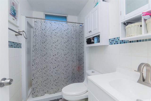 94-049 Waipahu St Unit 308, Waipahu, HI 96797 - bathroom featuring decorative backsplash, tile walls, vanity, and a shower stall
