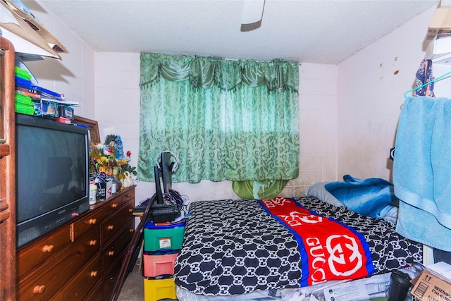 94-049 Waipahu St Unit 308, Waipahu, HI 96797 - bedroom with a textured ceiling and a ceiling fan