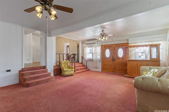 67-186 Kanoena St, Waialua, HI 96791 - carpeted living room with a ceiling fan, stairs, beam ceiling, and a wall unit AC