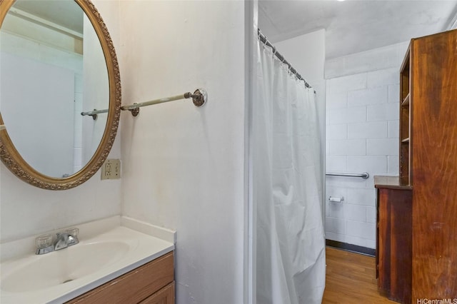 67-186 Kanoena St, Waialua, HI 96791 - full bathroom with vanity, wood finished floors, and a shower with curtain