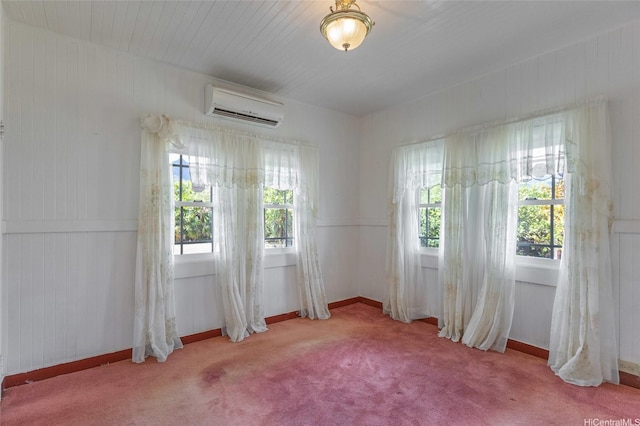 67-186 Kanoena St, Waialua, HI 96791 - carpeted spare room with healthy amount of natural light, a wall mounted AC, and wood walls