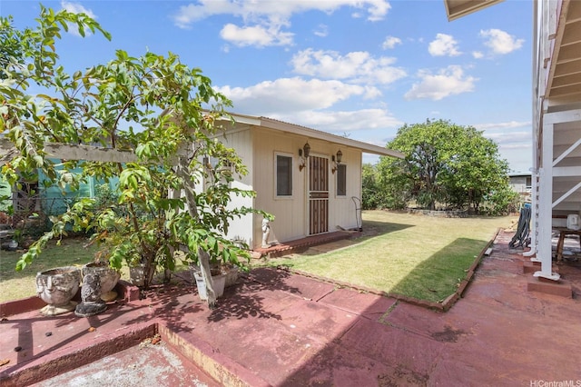 67-186 Kanoena St, Waialua, HI 96791 - view of grassy yard with a patio and an outbuilding