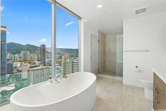 629 Keeaumoku St Unit 2212, Honolulu, HI 96814 - bathroom featuring a freestanding tub, a city view, a stall shower, and a mountain view