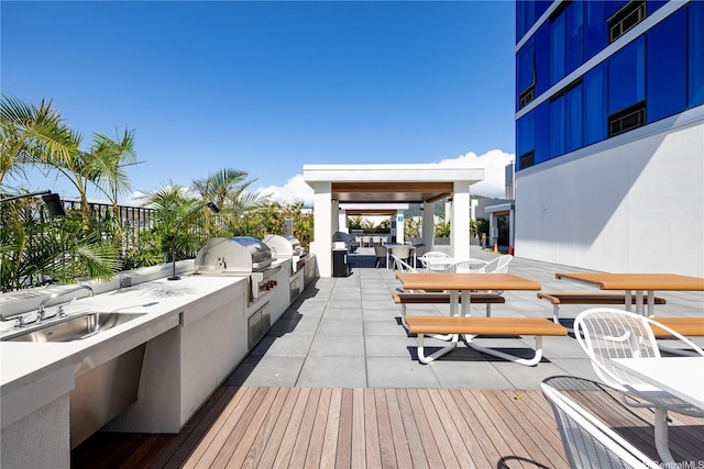 629 Keeaumoku St Unit 2212, Honolulu, HI 96814 - deck with exterior kitchen, outdoor dining space, and a patio