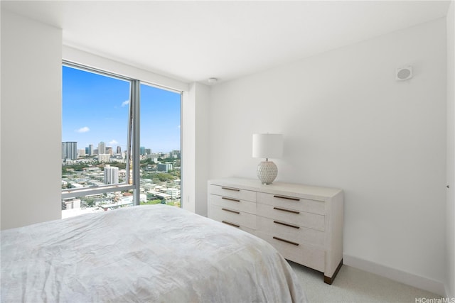 629 Keeaumoku St Unit 2212, Honolulu, HI 96814 - bedroom featuring light colored carpet and a view of skyline