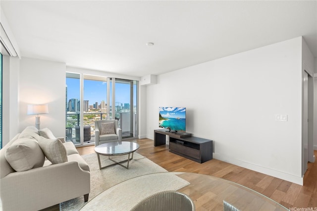 629 Keeaumoku St Unit 2212, Honolulu, HI 96814 - living room with wood finished floors and floor to ceiling windows