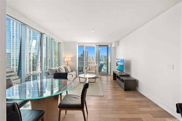 629 Keeaumoku St Unit 2212, Honolulu, HI 96814 - dining space featuring light wood-type flooring and floor to ceiling windows