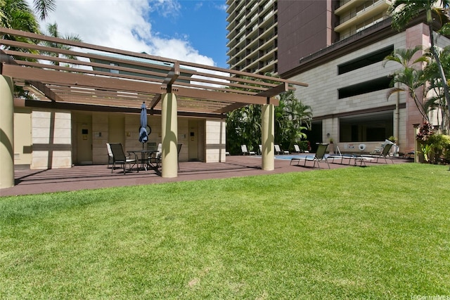 440 Olohana St Unit 1705, Honolulu, HI 96815 - back of house with a pergola, a patio, and a yard