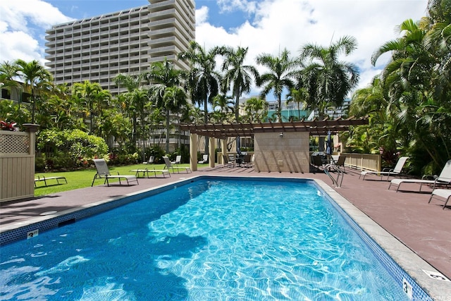 440 Olohana St Unit 1705, Honolulu, HI 96815 - community pool with a pergola, a lawn, and a patio area