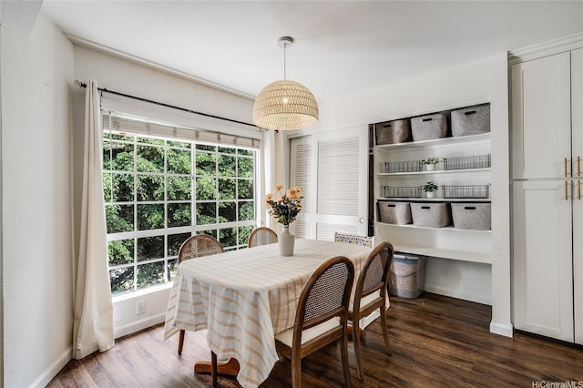 585 Mananai Pl Unit 26U, Honolulu, HI 96818 - dining room featuring dark wood-type flooring and plenty of natural light