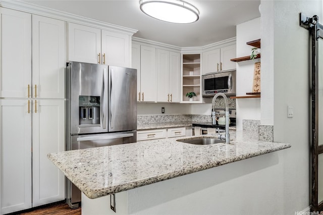 585 Mananai Pl Unit 26U, Honolulu, HI 96818 - kitchen with open shelves, appliances with stainless steel finishes, a peninsula, and white cabinetry