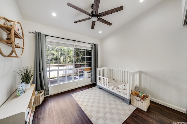 585 Mananai Pl Unit 26U, Honolulu, HI 96818 - bedroom with vaulted ceiling, wood finished floors, recessed lighting, a crib, and ceiling fan