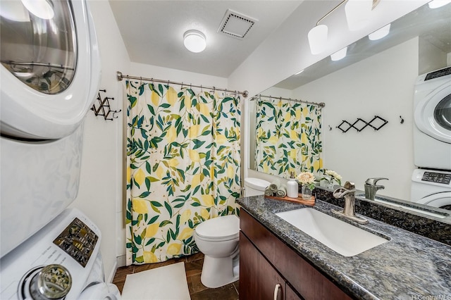 585 Mananai Pl Unit 26U, Honolulu, HI 96818 - full bathroom featuring estacked washer and dryer, vanity, a shower with curtain, and tile patterned flooring