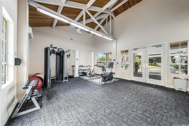 585 Mananai Pl Unit 26U, Honolulu, HI 96818 - exercise room featuring high vaulted ceiling, carpet floors, french doors, an AC wall unit, and beam ceiling