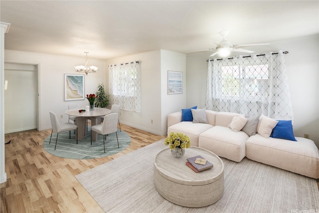 4134 Likini St, Honolulu, HI 96818 - living area with a chandelier, light wood finished floors, ceiling fan, and crown molding