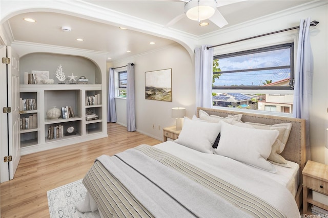 4134 Likini St, Honolulu, HI 96818 - bedroom with ornamental molding, arched walkways, wood finished floors, and recessed lighting