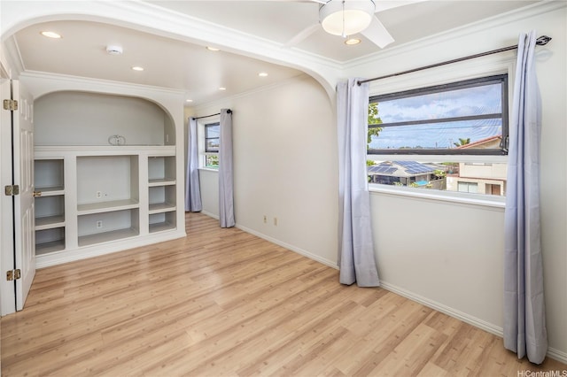 4134 Likini St, Honolulu, HI 96818 - unfurnished room with arched walkways, ornamental molding, light wood-type flooring, and recessed lighting