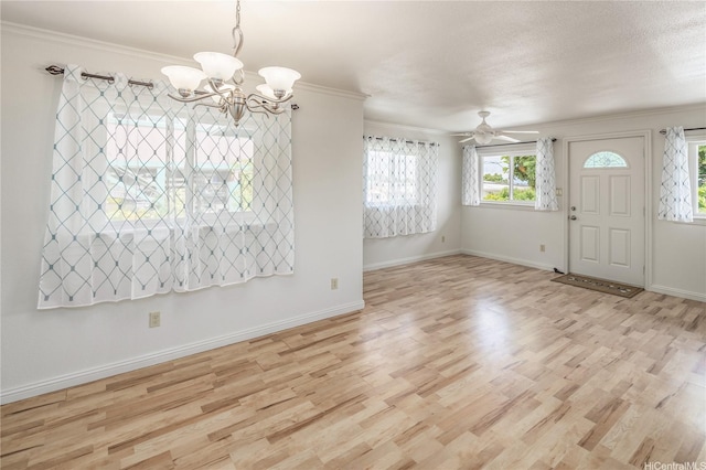 4134 Likini St, Honolulu, HI 96818 - foyer featuring a chandelier, light wood-style floors, crown molding, and ceiling fan