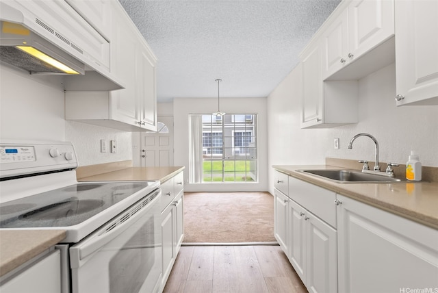 94-1369 Kulewa Loop Unit 14B, Waipahu, HI 96797 - kitchen featuring white electric stove, exhaust hood, a textured ceiling, white cabinetry, and light countertops