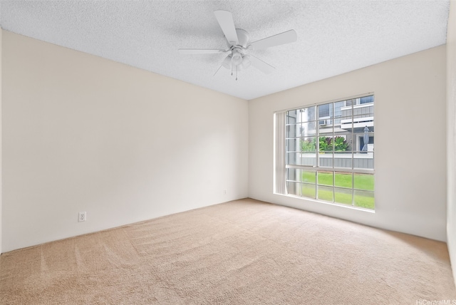 94-1369 Kulewa Loop Unit 14B, Waipahu, HI 96797 - carpeted spare room featuring a ceiling fan and a textured ceiling