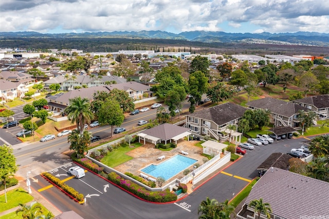 94-1369 Kulewa Loop Unit 14B, Waipahu, HI 96797 - aerial perspective of suburban area featuring a mountain backdrop and a pool