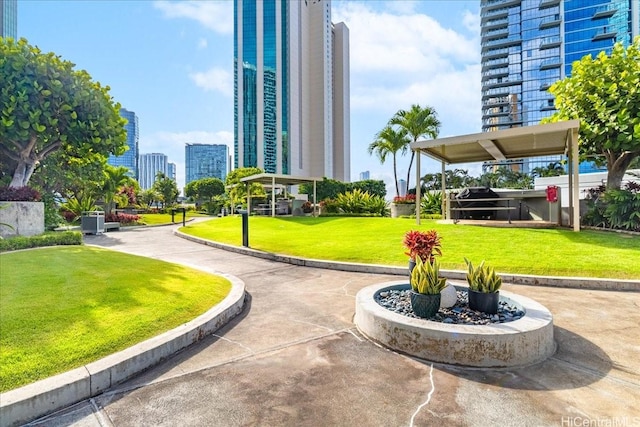 1330 Ala Moana Blvd Unit 1907, Honolulu, HI 96814 - view of property's community with a view of skyline and a lawn