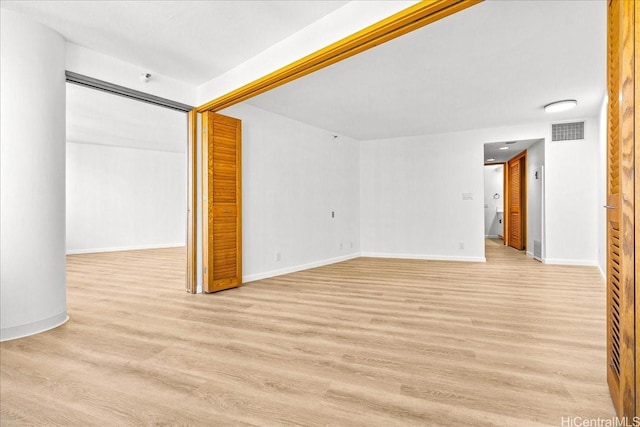 1330 Ala Moana Blvd Unit 1907, Honolulu, HI 96814 - unfurnished living room with light wood-style floors and baseboards