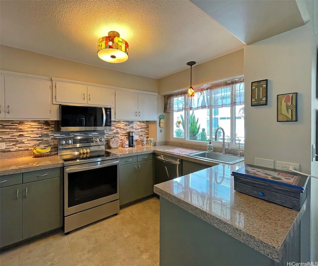 320 Ainakea Way Unit 812, Honolulu, HI 96815 - kitchen with stainless steel appliances, tasteful backsplash, white cabinetry, a textured ceiling, and decorative light fixtures