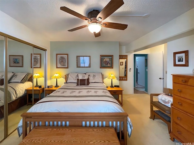 320 Ainakea Way Unit 812, Honolulu, HI 96815 - carpeted bedroom featuring a closet, a textured ceiling, and ceiling fan
