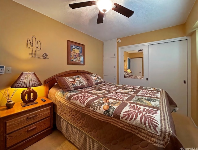 320 Ainakea Way Unit 812, Honolulu, HI 96815 - bedroom featuring light carpet, a closet, ceiling fan, and a textured ceiling
