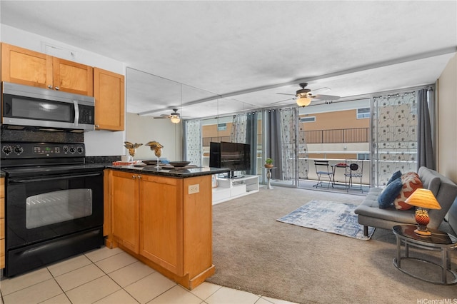 430 Kaiolu St Unit 505, Honolulu, HI 96815 - kitchen featuring black electric range, stainless steel microwave, open floor plan, and ceiling fan