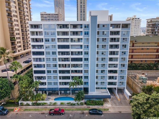 430 Kaiolu St Unit 505, Honolulu, HI 96815 - view of apartment building / complex with uncovered parking and a city view
