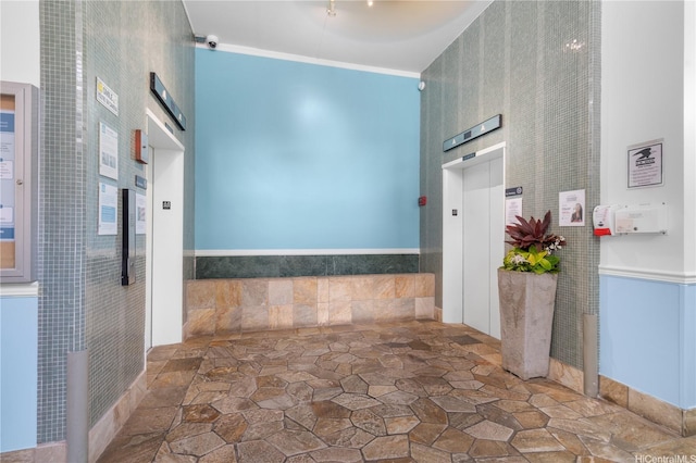 430 Kaiolu St Unit 505, Honolulu, HI 96815 - hallway featuring a high ceiling, stone finish floors, and elevator
