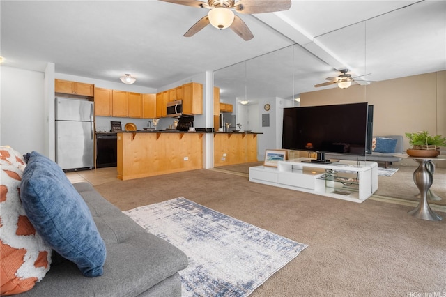 430 Kaiolu St Unit 505, Honolulu, HI 96815 - living area with a ceiling fan and light colored carpet